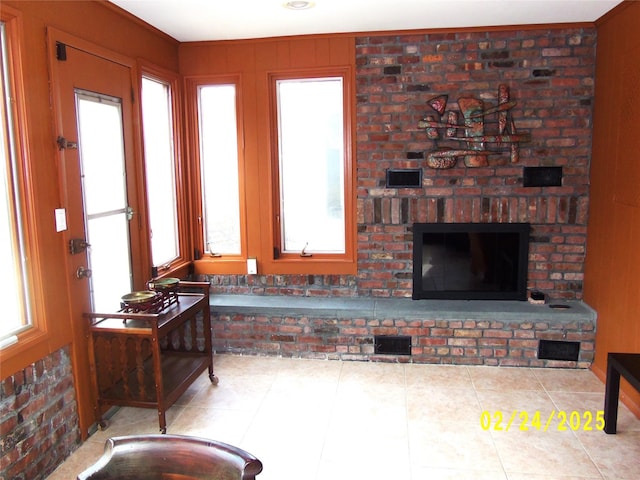 interior space featuring a wealth of natural light and a fireplace