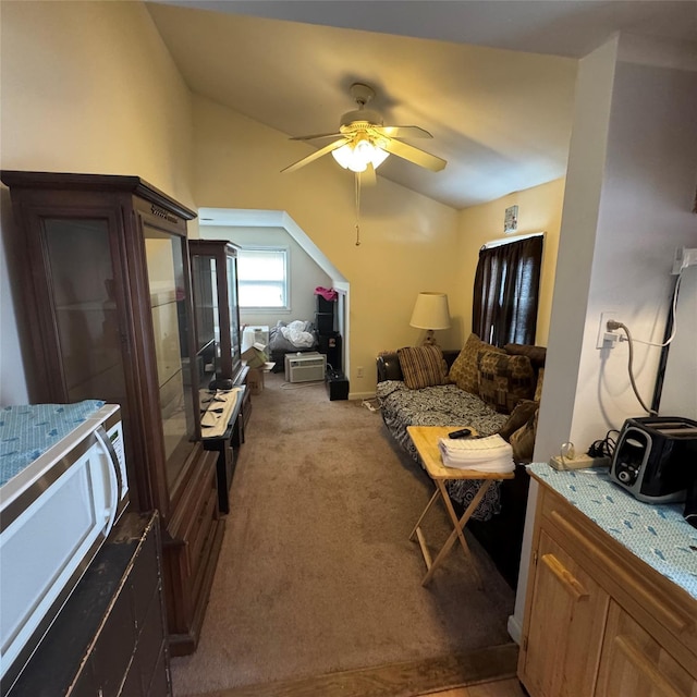 living room featuring light carpet, ceiling fan, and lofted ceiling