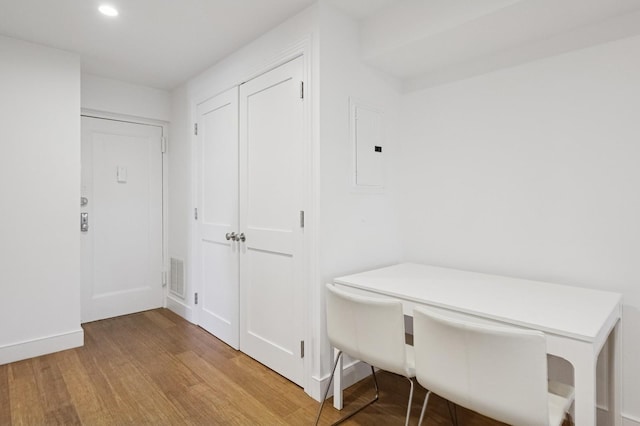 interior space with recessed lighting, wood finished floors, visible vents, baseboards, and electric panel