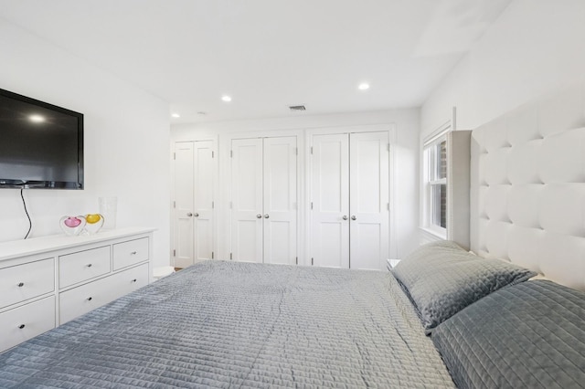 bedroom with visible vents, multiple closets, and recessed lighting