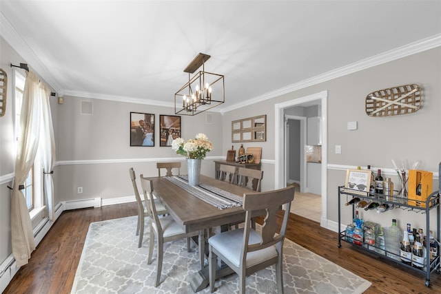 dining space with wood finished floors, a healthy amount of sunlight, baseboards, and ornamental molding