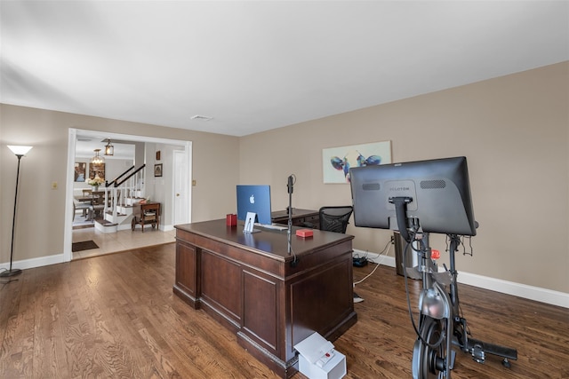 office featuring visible vents, baseboards, and dark wood-style flooring