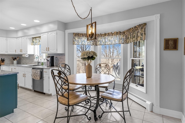 dining area featuring light tile patterned floors, baseboards, an inviting chandelier, and recessed lighting