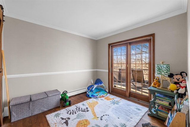 interior space featuring ornamental molding, wood finished floors, and a baseboard radiator