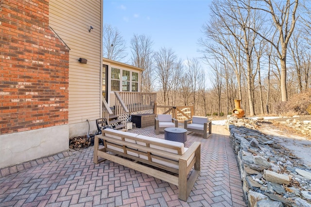 view of patio with a deck and an outdoor living space