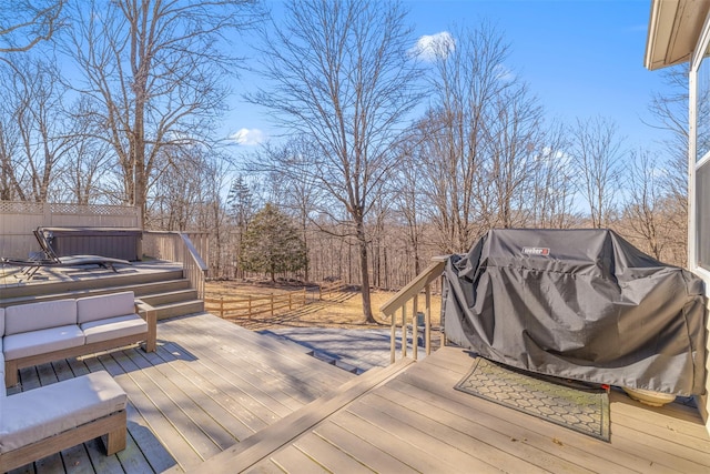 wooden terrace with area for grilling and a jacuzzi