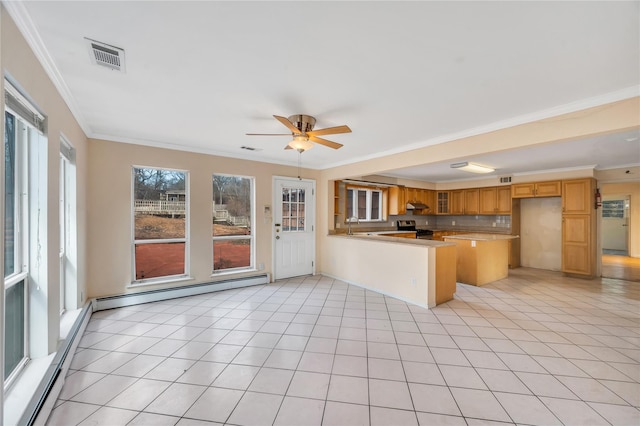 kitchen with light tile patterned floors, visible vents, baseboard heating, stainless steel gas range, and a peninsula