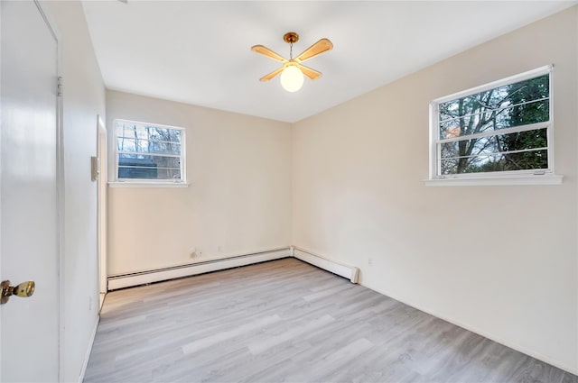 empty room featuring a baseboard radiator, ceiling fan, and wood finished floors