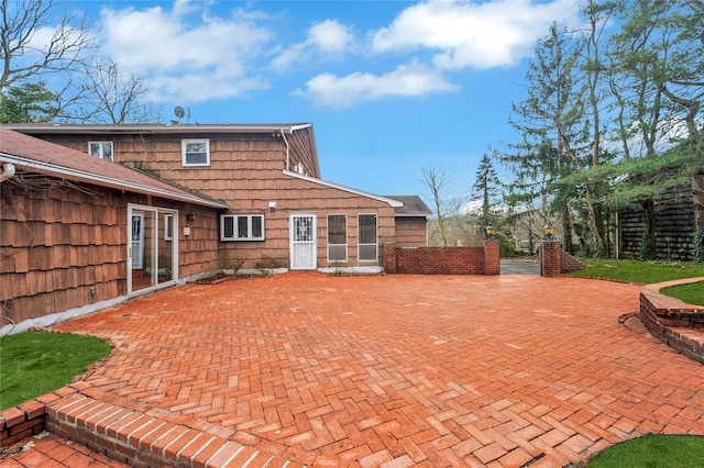 back of house with a patio area and fence