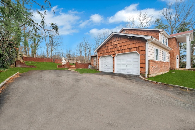 garage with aphalt driveway