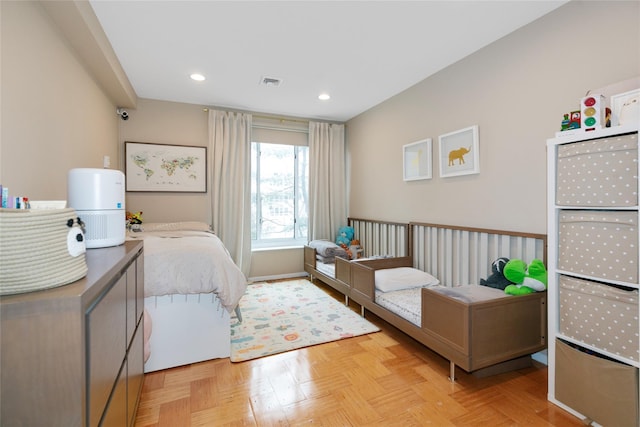 bedroom with visible vents and recessed lighting