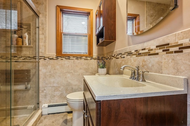 full bathroom with a baseboard heating unit, tile walls, a shower stall, and toilet