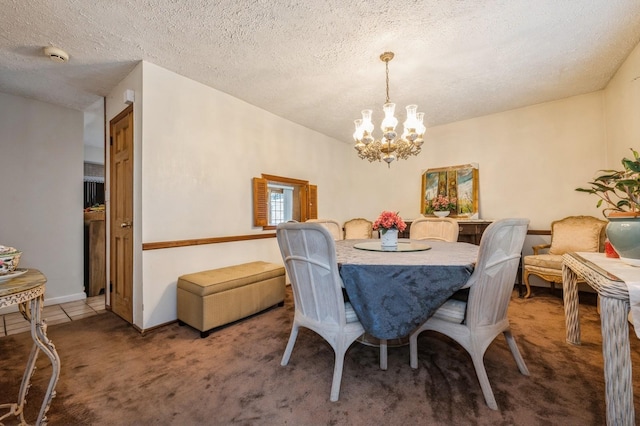 carpeted dining area featuring tile patterned flooring, a notable chandelier, and a textured ceiling