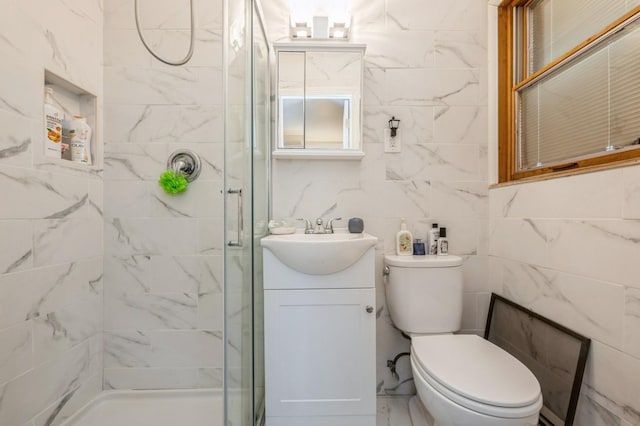 full bathroom with toilet, marble finish floor, a shower stall, and vanity