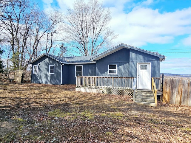 rear view of house with fence