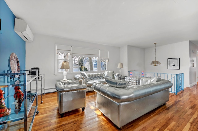 living area with hardwood / wood-style floors and a wall mounted AC