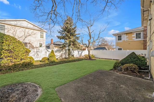 view of yard featuring a patio area and a fenced backyard