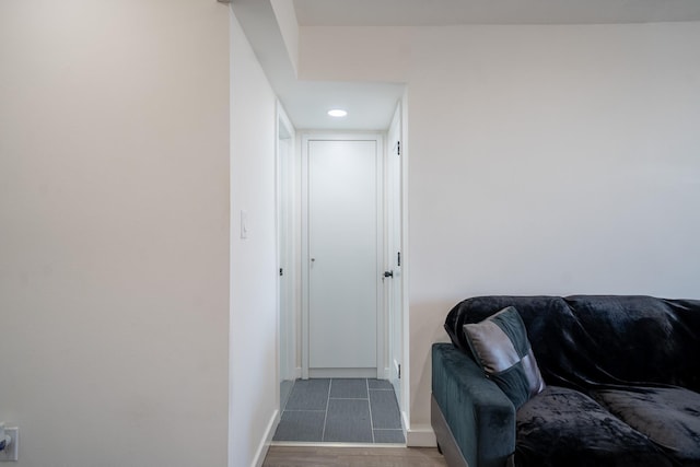 interior space featuring wood finished floors and baseboards