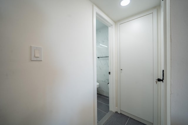 hallway featuring tile patterned flooring and recessed lighting