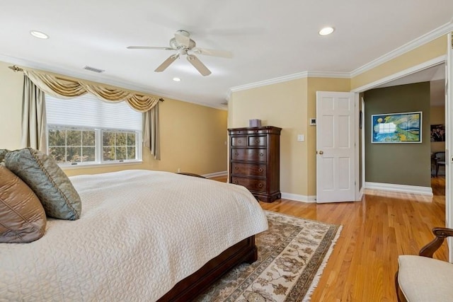 bedroom with visible vents, baseboards, ceiling fan, ornamental molding, and light wood-style floors