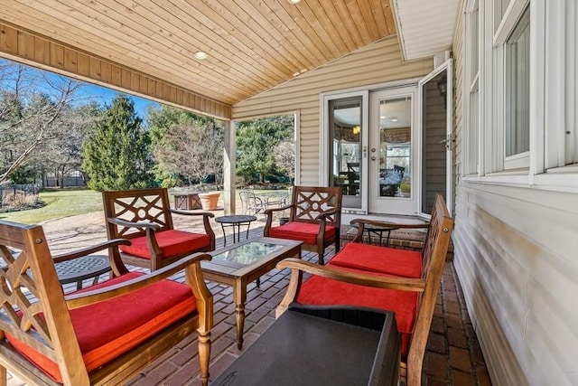 wooden deck with an outdoor living space and french doors