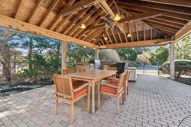 view of patio / terrace featuring a gazebo, a grill, and outdoor dining space