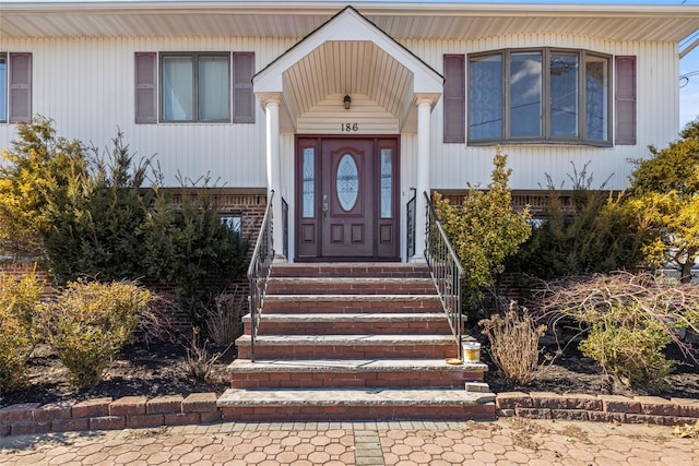 entrance to property with brick siding