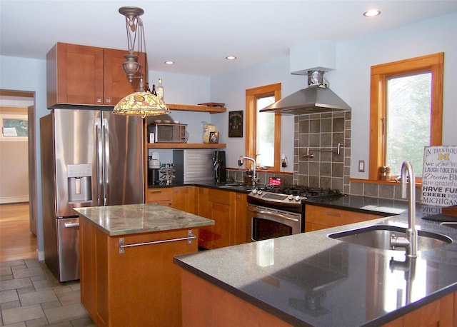 kitchen featuring a sink, a healthy amount of sunlight, appliances with stainless steel finishes, brown cabinets, and open shelves