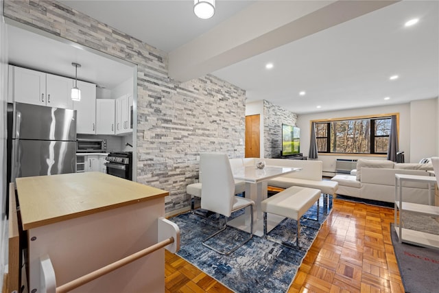 living room with a toaster and recessed lighting