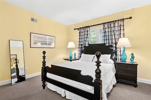 carpeted bedroom with visible vents and baseboards