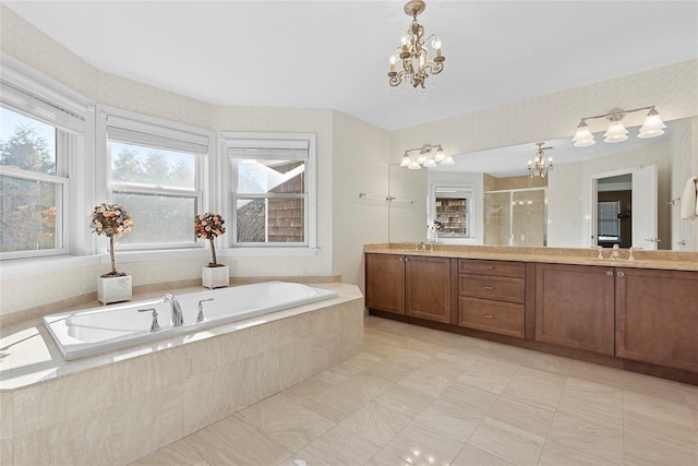 full bathroom with a shower stall, vanity, a bath, a chandelier, and wallpapered walls