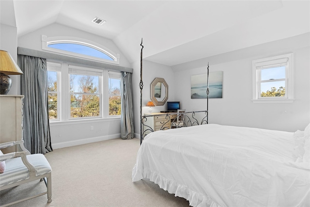 carpeted bedroom with lofted ceiling, visible vents, and baseboards