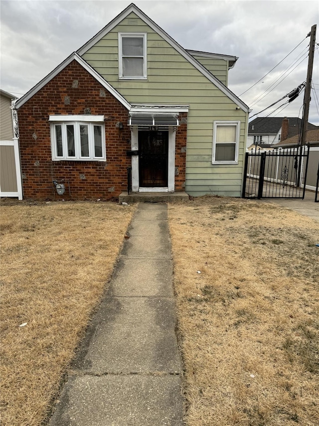 traditional home with brick siding and fence