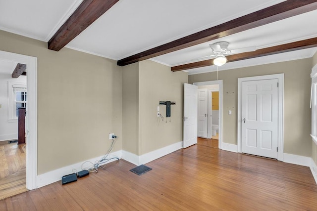 200 Village Ln, Orient, NY 11957 - empty room featuring wood finished floors, beamed ceiling, baseboards, and a ceiling fan