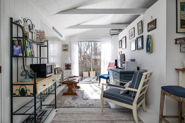 interior space with vaulted ceiling with beams and a wall unit AC