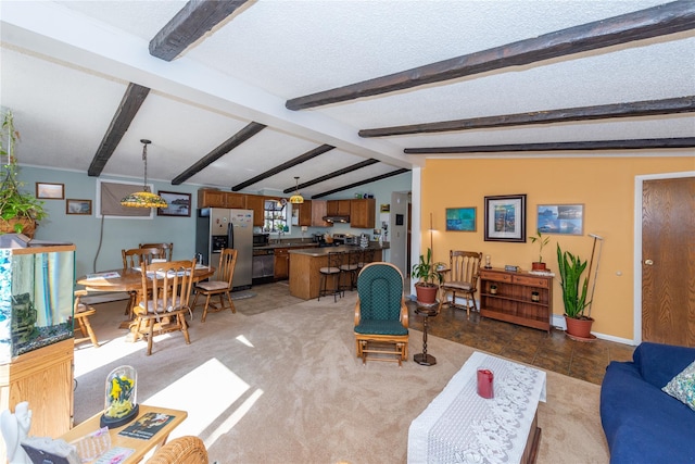 living room with light colored carpet, baseboards, lofted ceiling with beams, and a textured ceiling