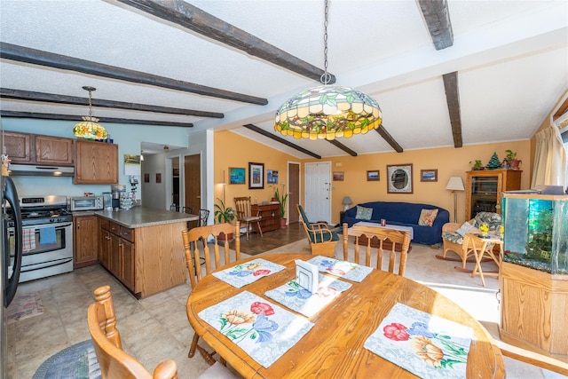 dining area with a toaster and vaulted ceiling with beams