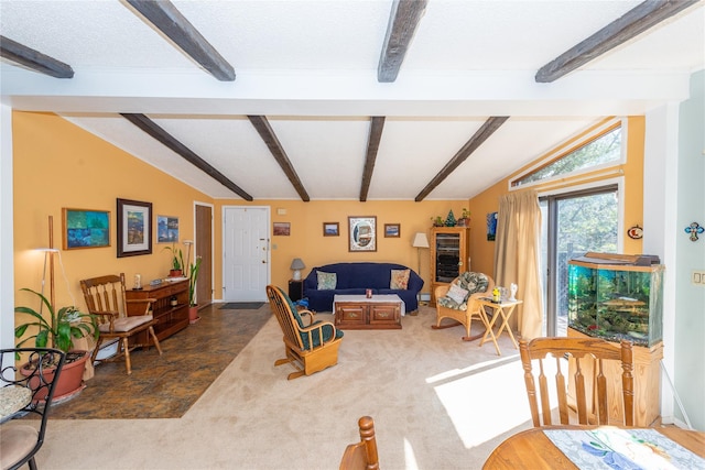 carpeted living area featuring lofted ceiling with beams