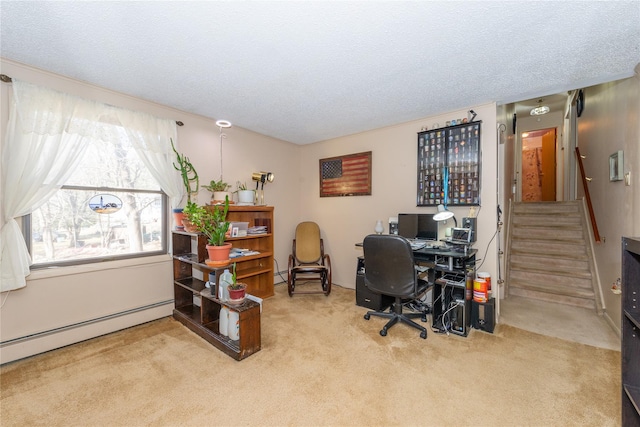 carpeted office featuring a baseboard heating unit and a textured ceiling