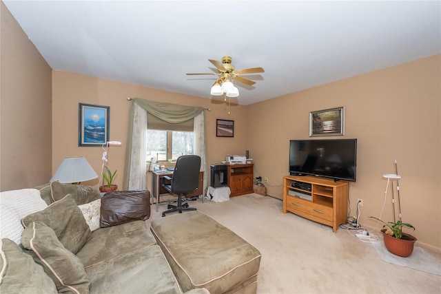 living room with a ceiling fan and light colored carpet