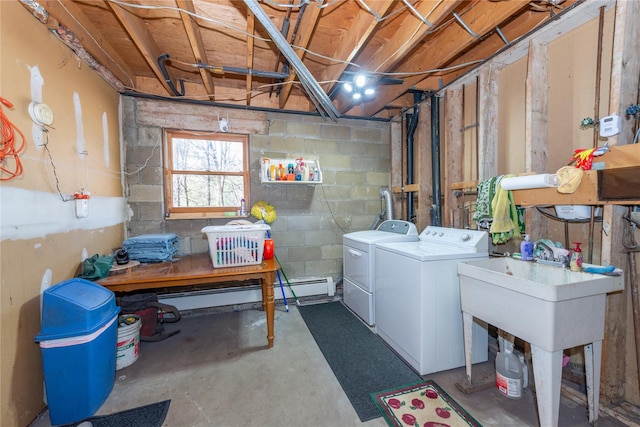 below grade area featuring concrete block wall and independent washer and dryer