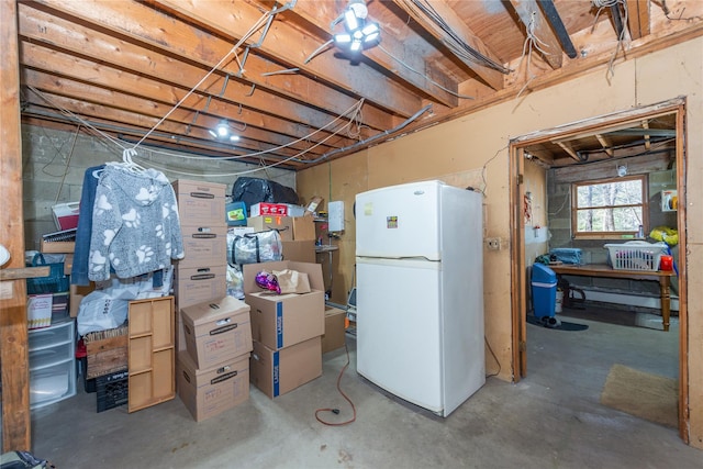 basement with freestanding refrigerator