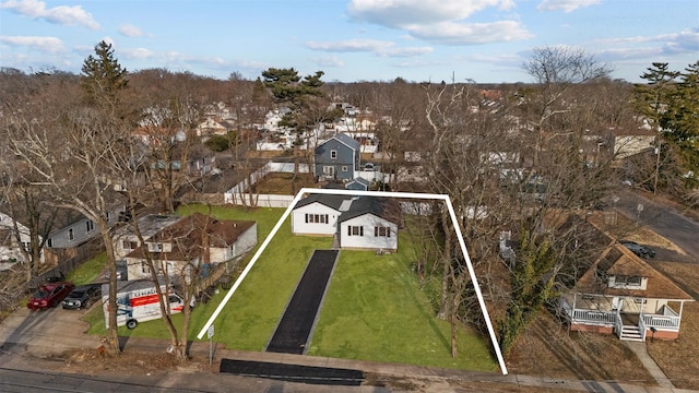 birds eye view of property with a residential view