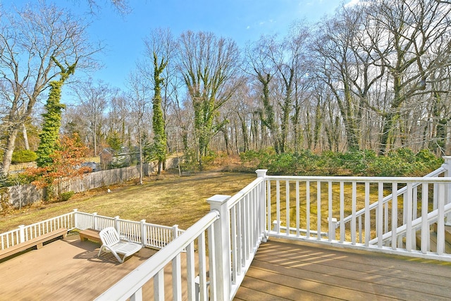 wooden terrace with a yard