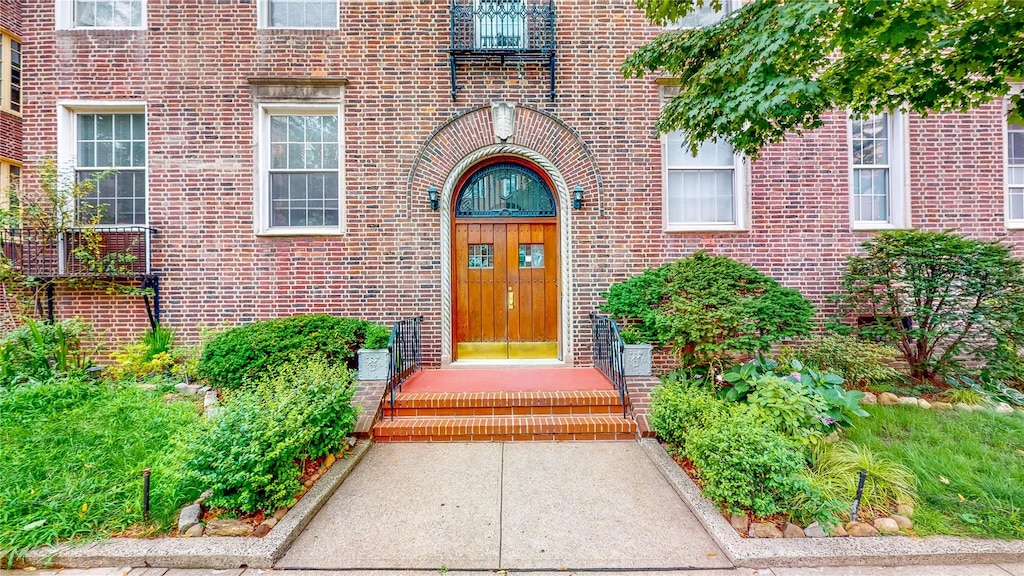 entrance to property with brick siding