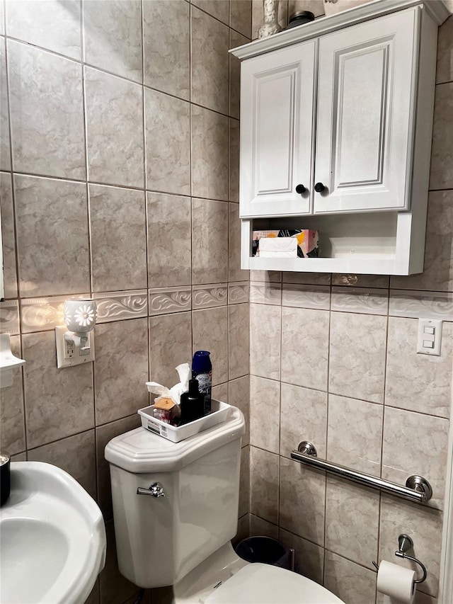 bathroom featuring toilet and a sink