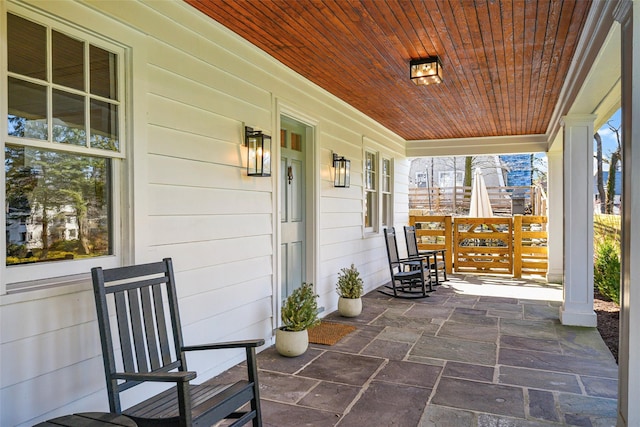 view of patio featuring a porch