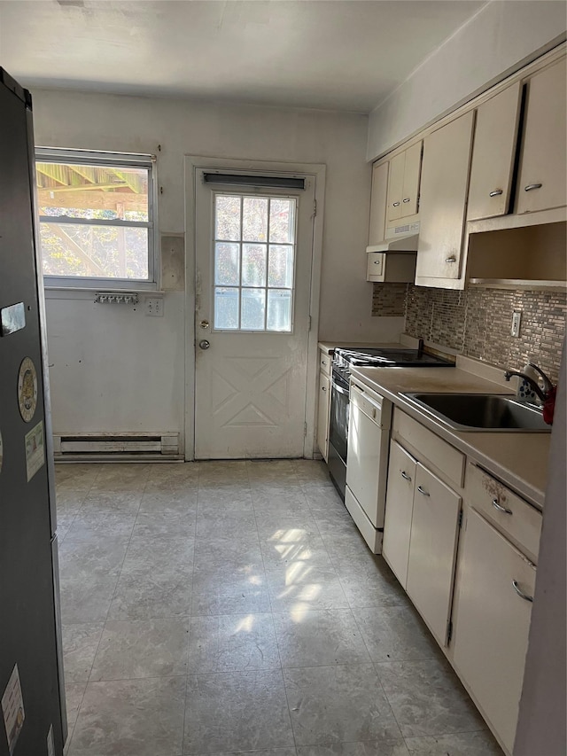 kitchen featuring backsplash, baseboard heating, a sink, dishwasher, and under cabinet range hood