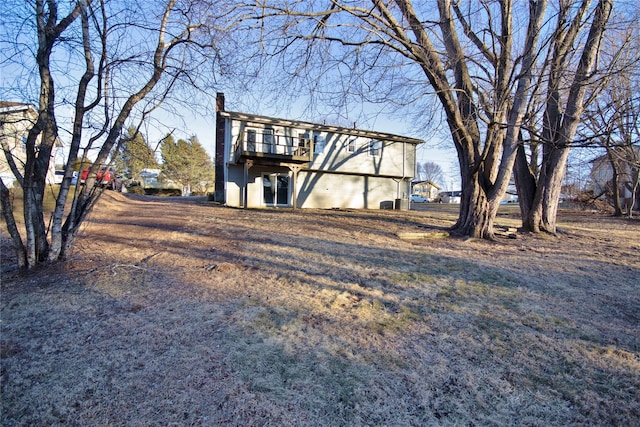 exterior space featuring a wooden deck and a chimney