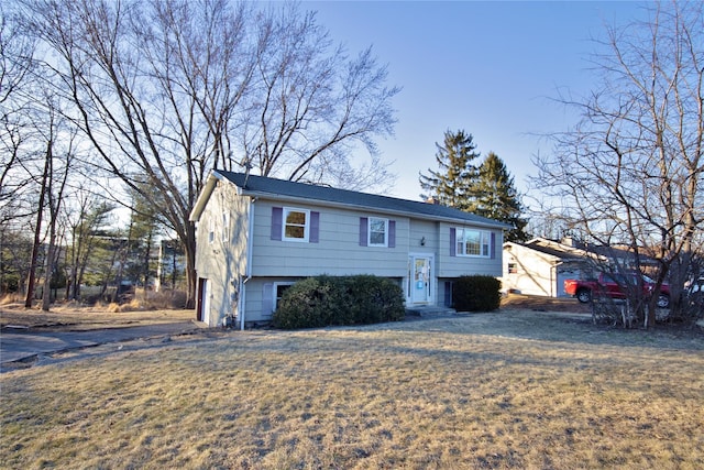 raised ranch featuring a front yard